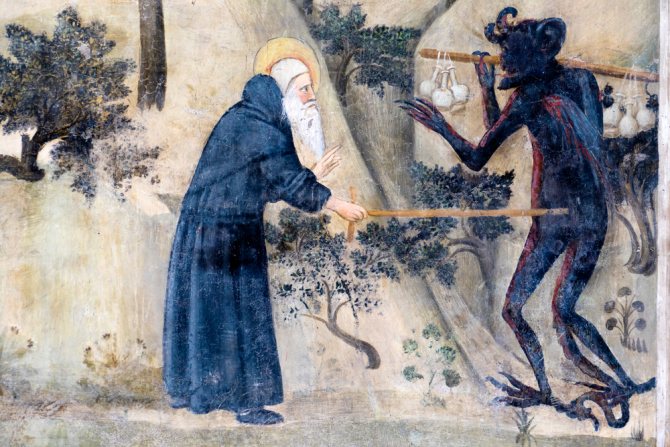 Святой отшельник прогоняет беса (средневековая христианская фреска)